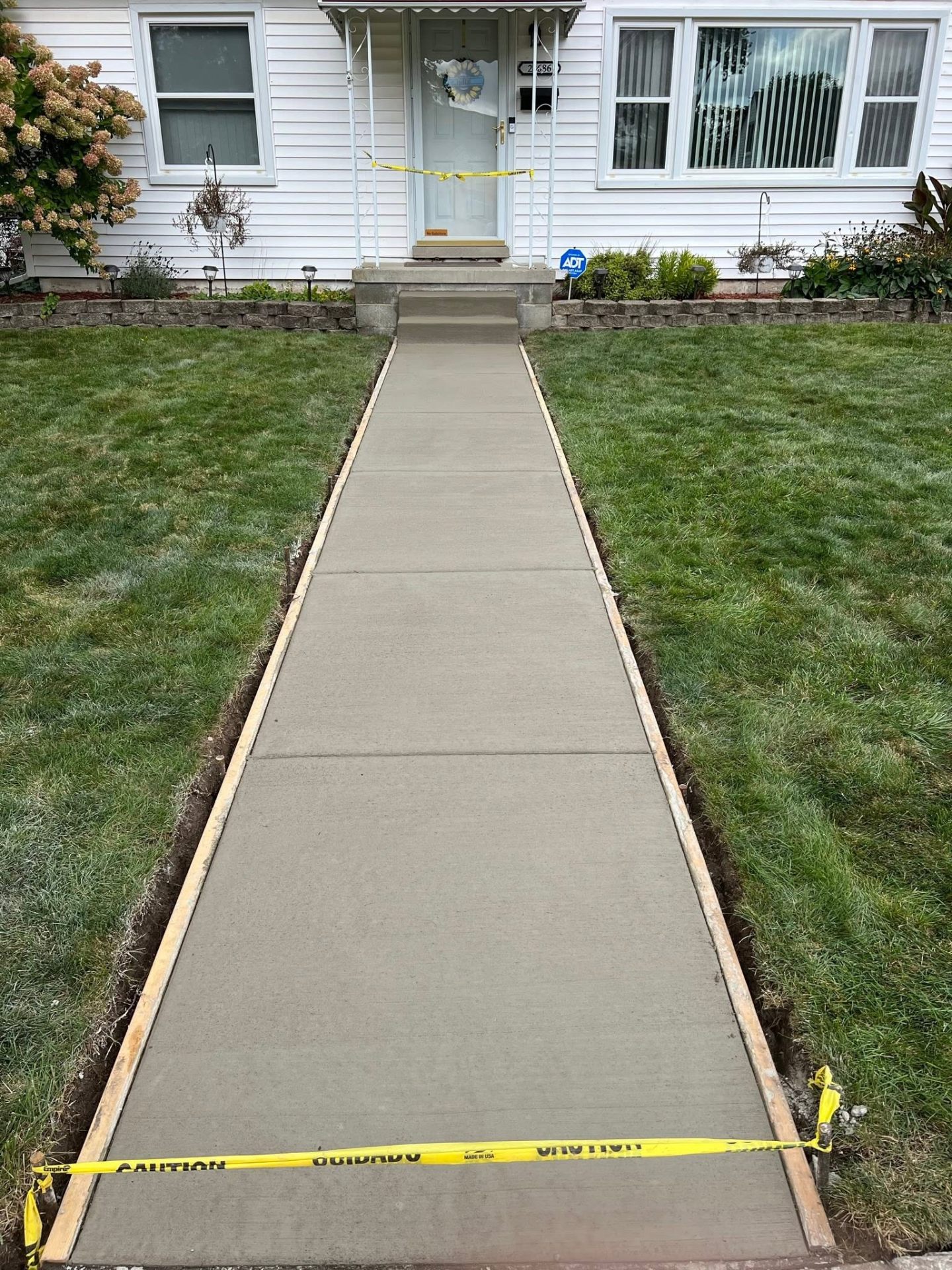 Freshly poured concrete sidewalk from the street