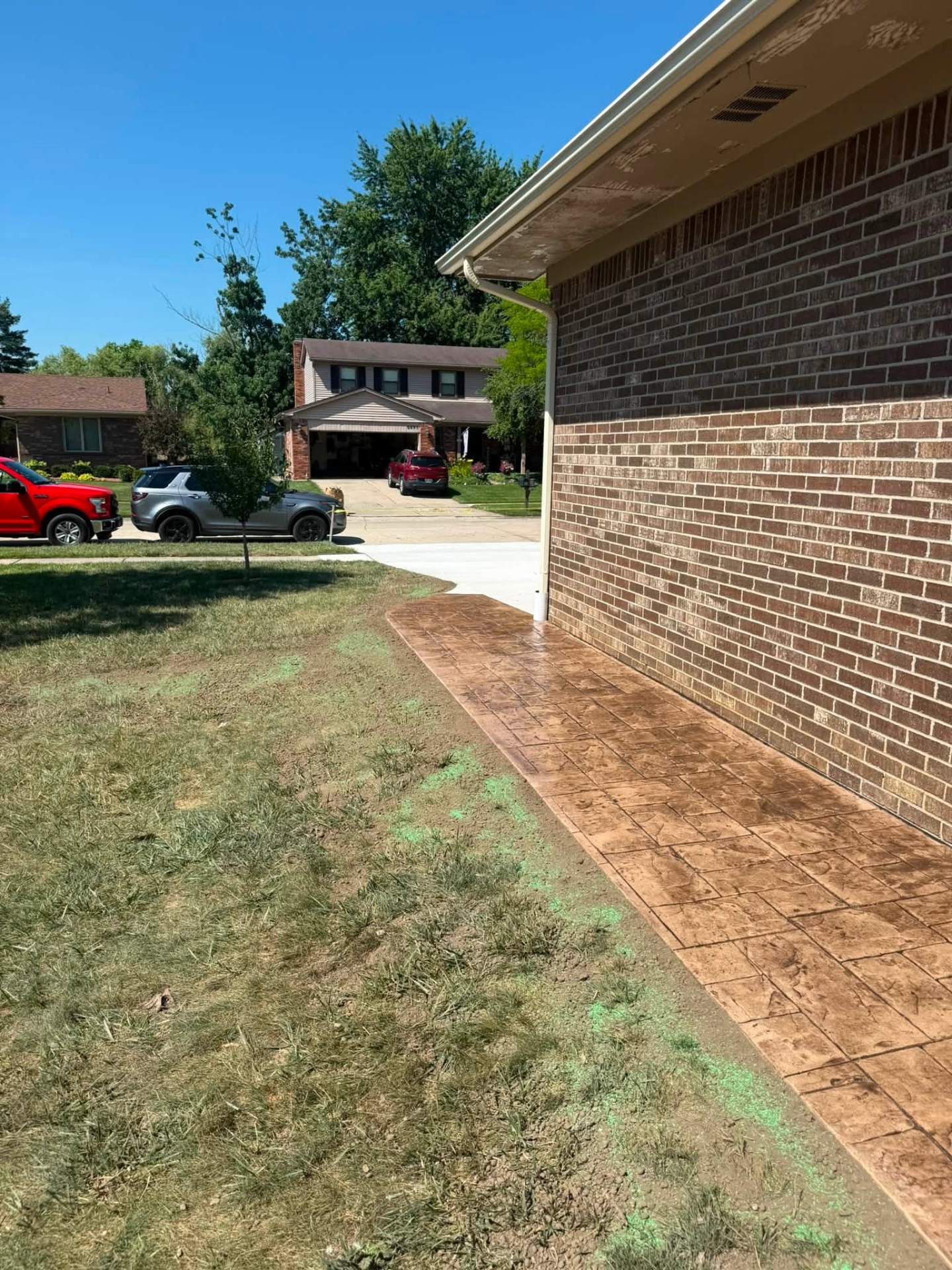 Canton project — stamped walkway meeting new concrete driveway