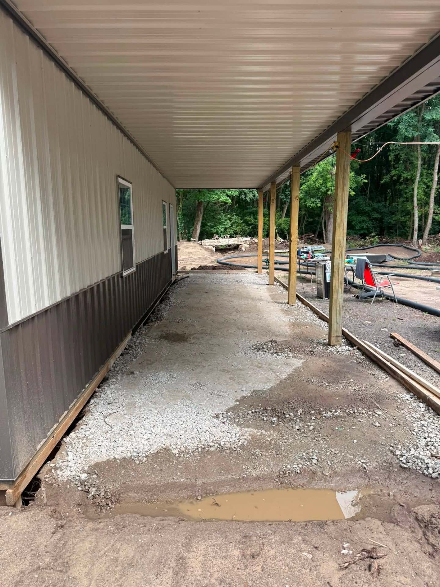Pole barn side porch — gravel base along full length