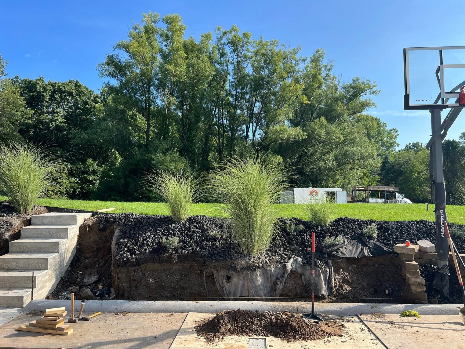 Retaining wall with steps and ornamental grasses