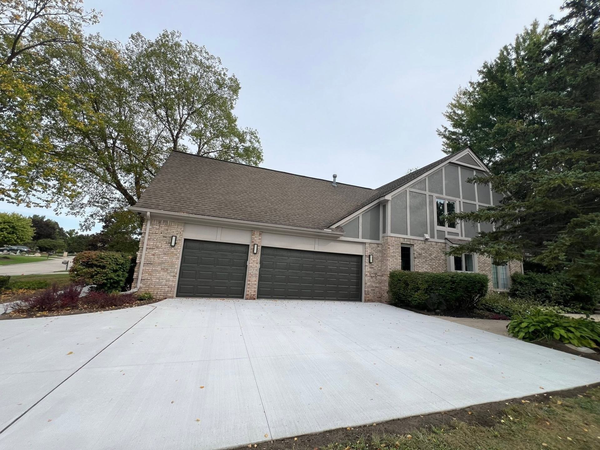 Completed three-car concrete driveway replacement in Plymouth, Michigan