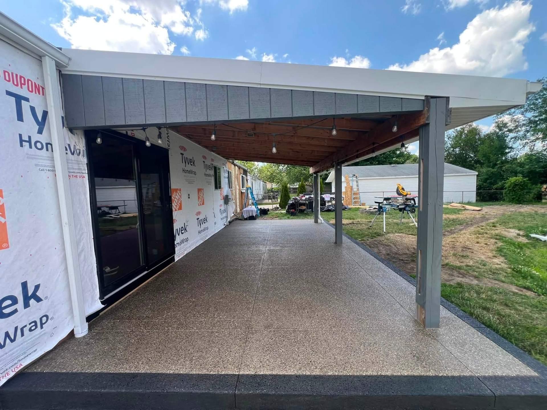 Aggregate walkway through covered pergola