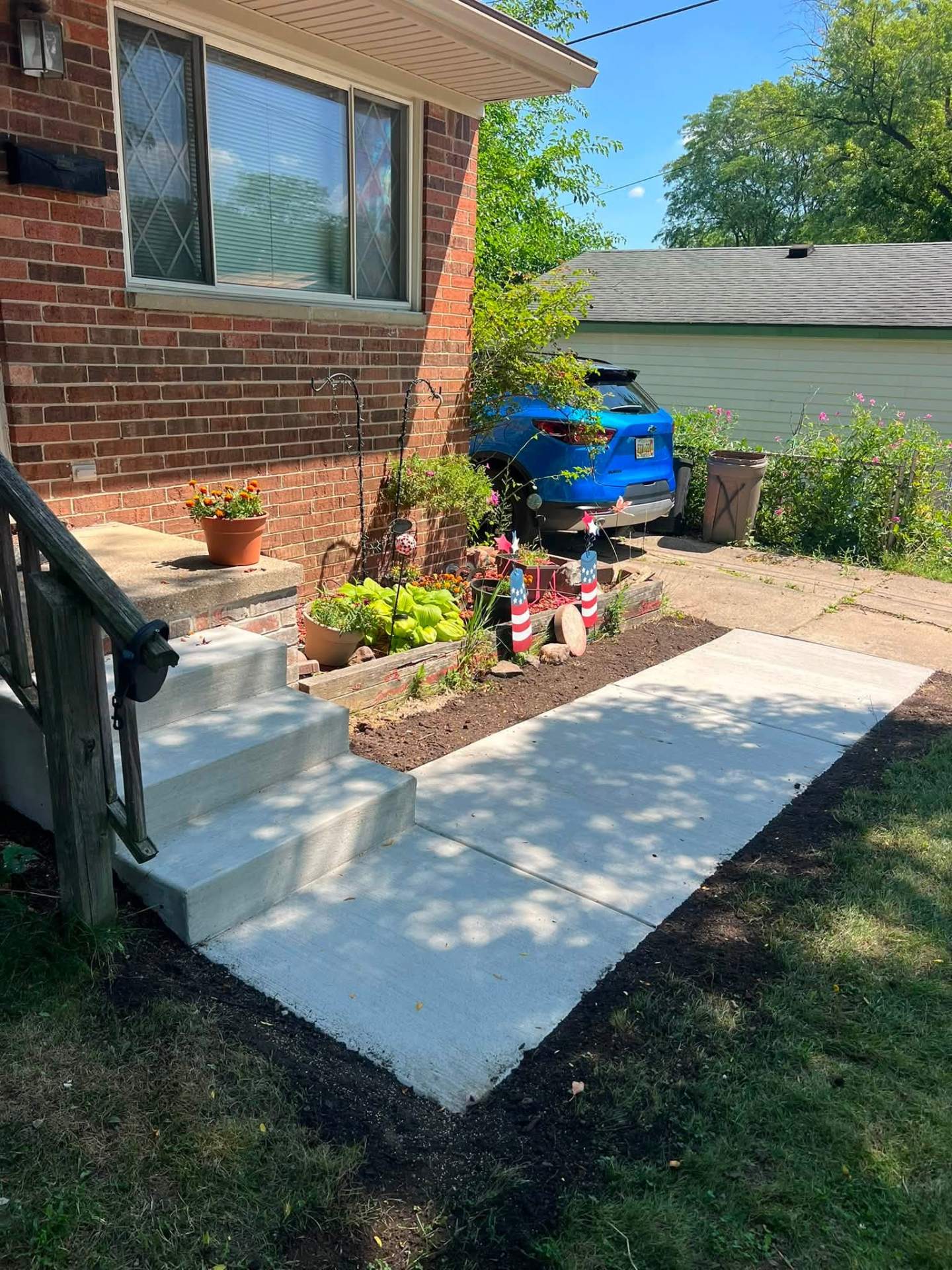 Angled view of the completed front entry steps and walkway